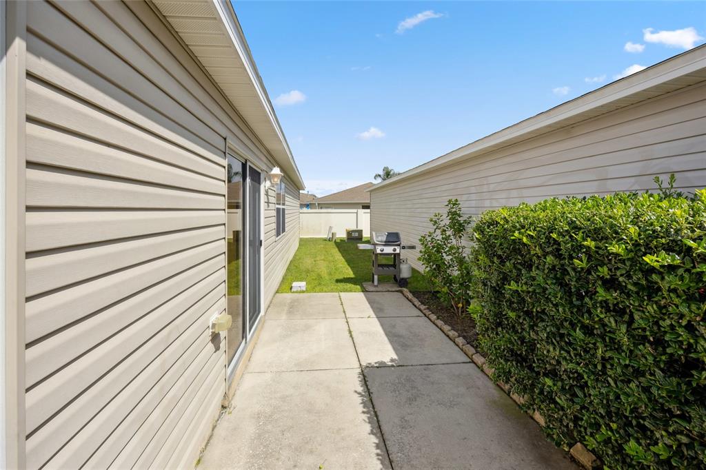 2372 Travis Place The Villages, FL 32162 - Photo 24 of 33 a view of a pathway with a pathway