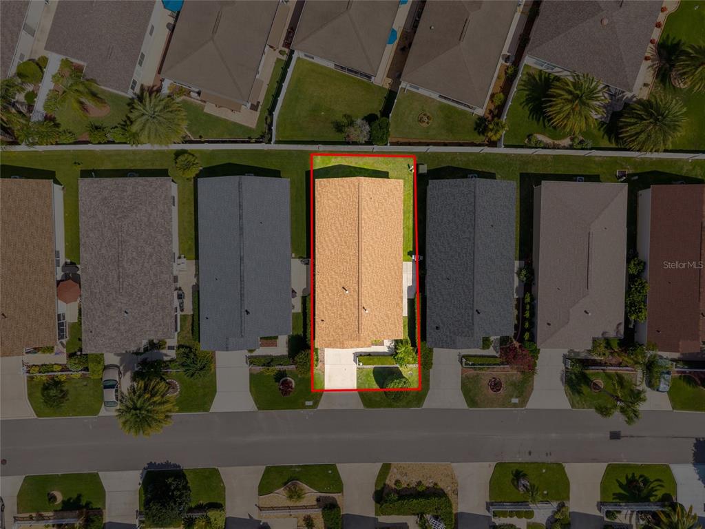 2372 Travis Place The Villages, FL 32162 - Photo 27 of 33 a front view of a house with a garden