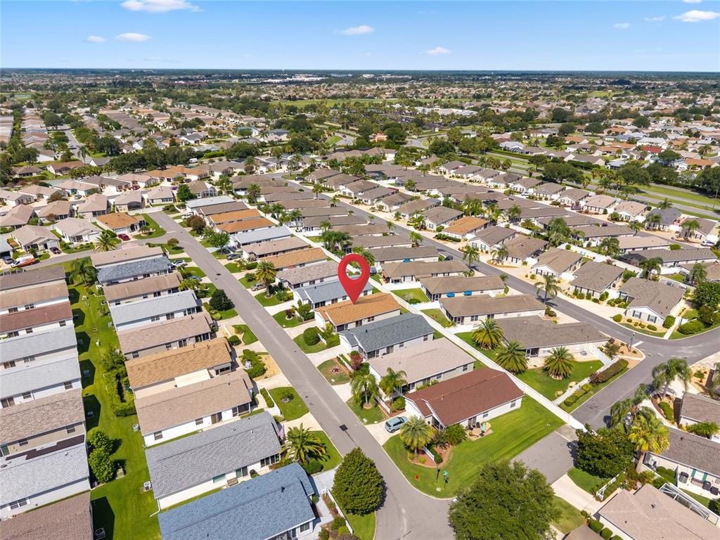 2372 Travis Place The Villages, FL 32162 - Photo 29 of 33 an aerial view of residential houses with outdoor space