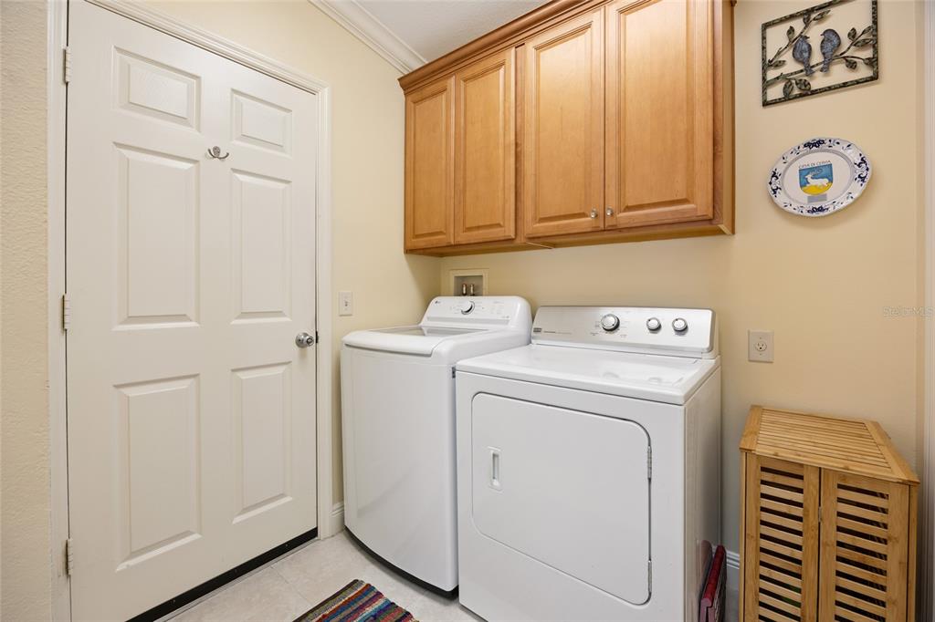 2372 Travis Place The Villages, FL 32162 - Photo 10 of 33 a utility room with dryer and washer