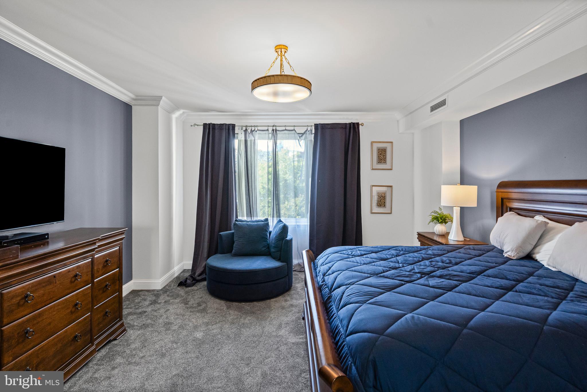 801 Key Highway, Unit 345 Baltimore, MD 21230 - Photo 19 of 57 a bedroom with a bed and a television