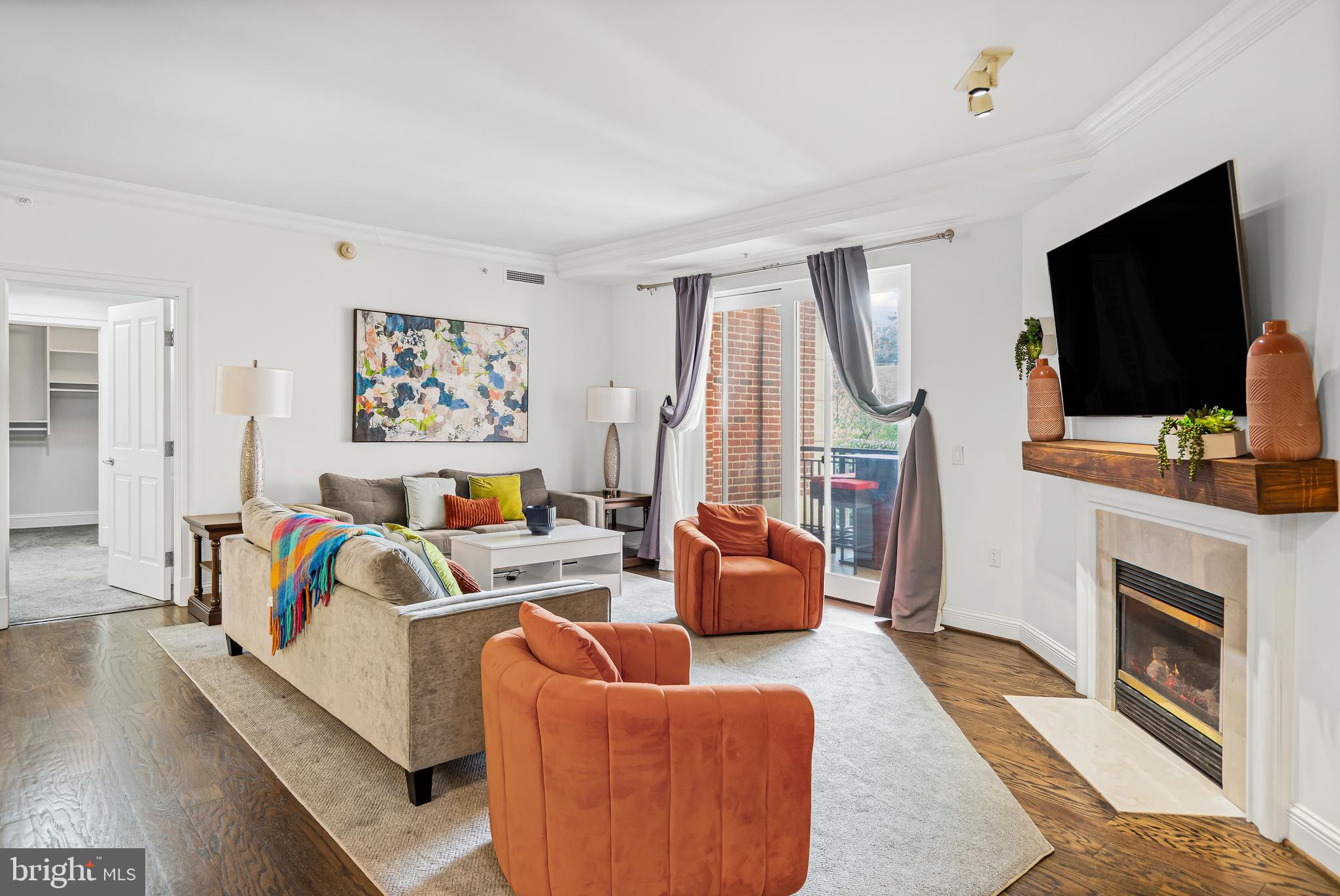 801 Key Highway, Unit 345 Baltimore, MD 21230 - Photo 3 of 57 a living room with fireplace furniture and a flat screen tv