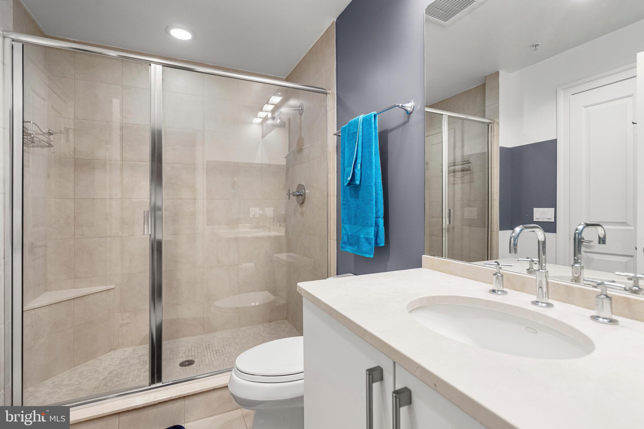 801 Key Highway, Unit 345 Baltimore, MD 21230 - Photo 32 of 57 a bathroom with a sink toilet and shower