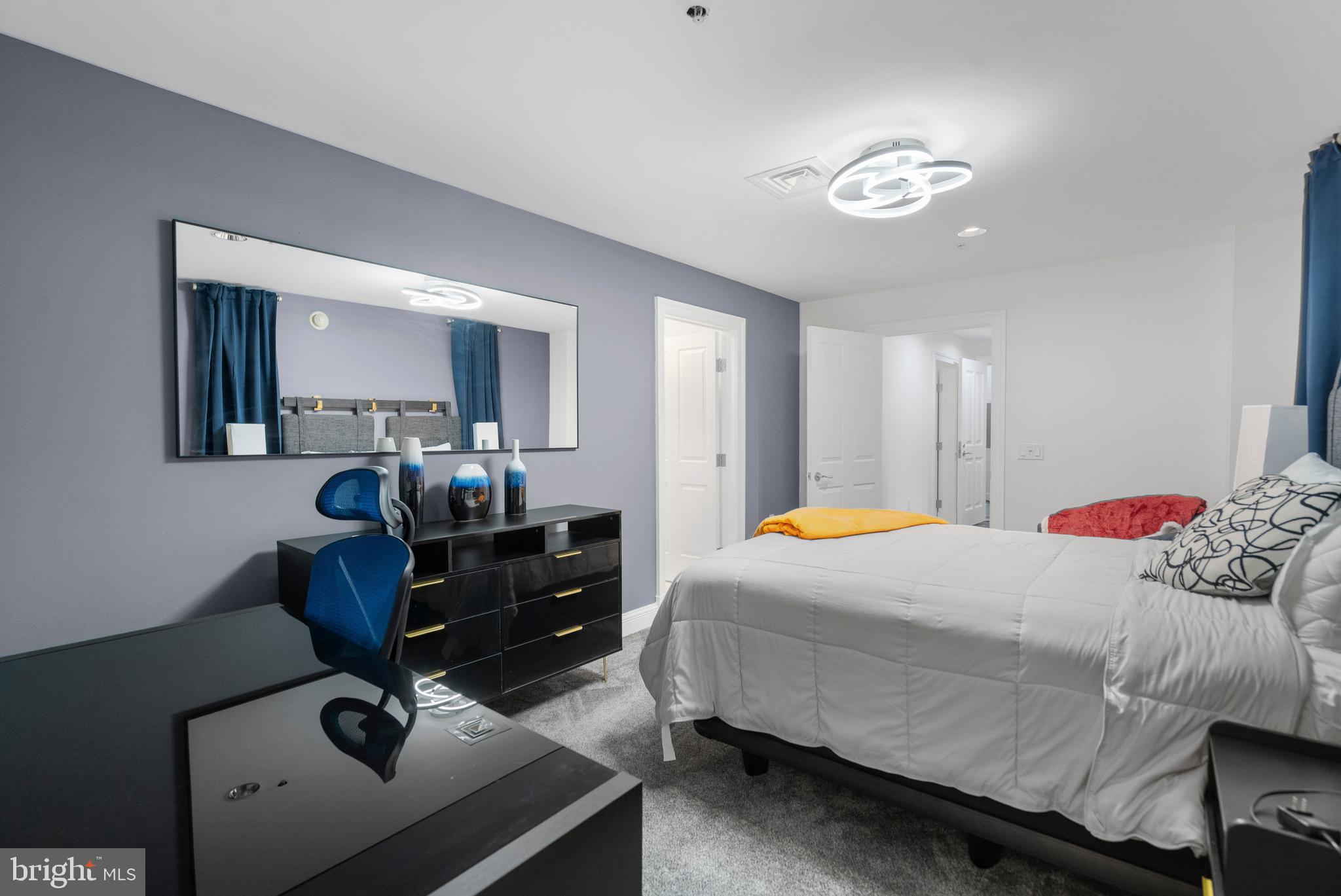 801 Key Highway, Unit 345 Baltimore, MD 21230 - Photo 35 of 57 a bedroom with a bed and furniture