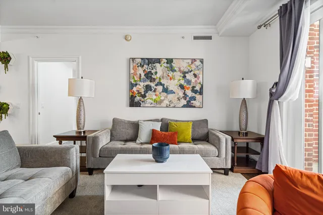 a living room with furniture and a table