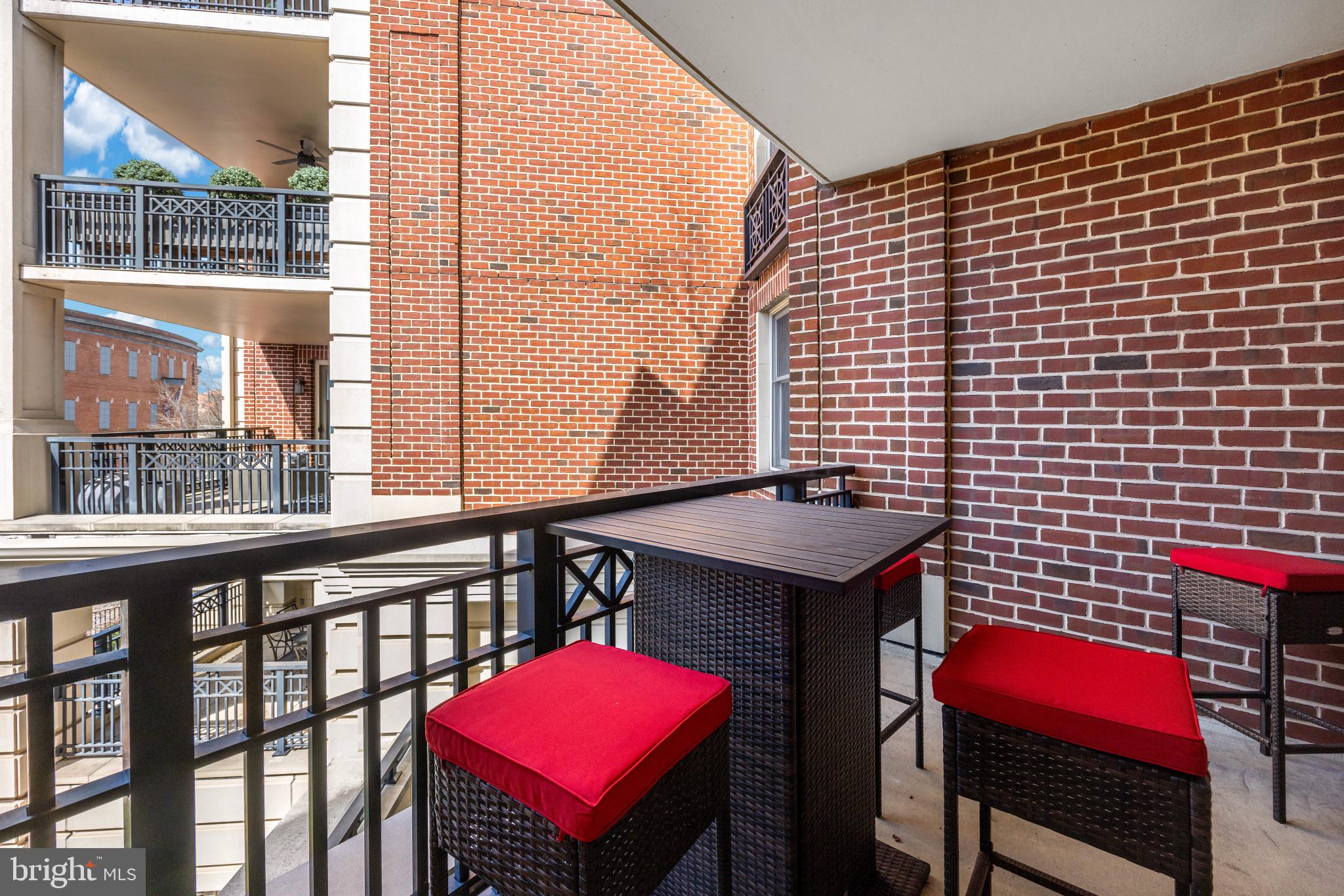 801 Key Highway, Unit 345 Baltimore, MD 21230 - Photo 44 of 57 a view of a balcony with chairs