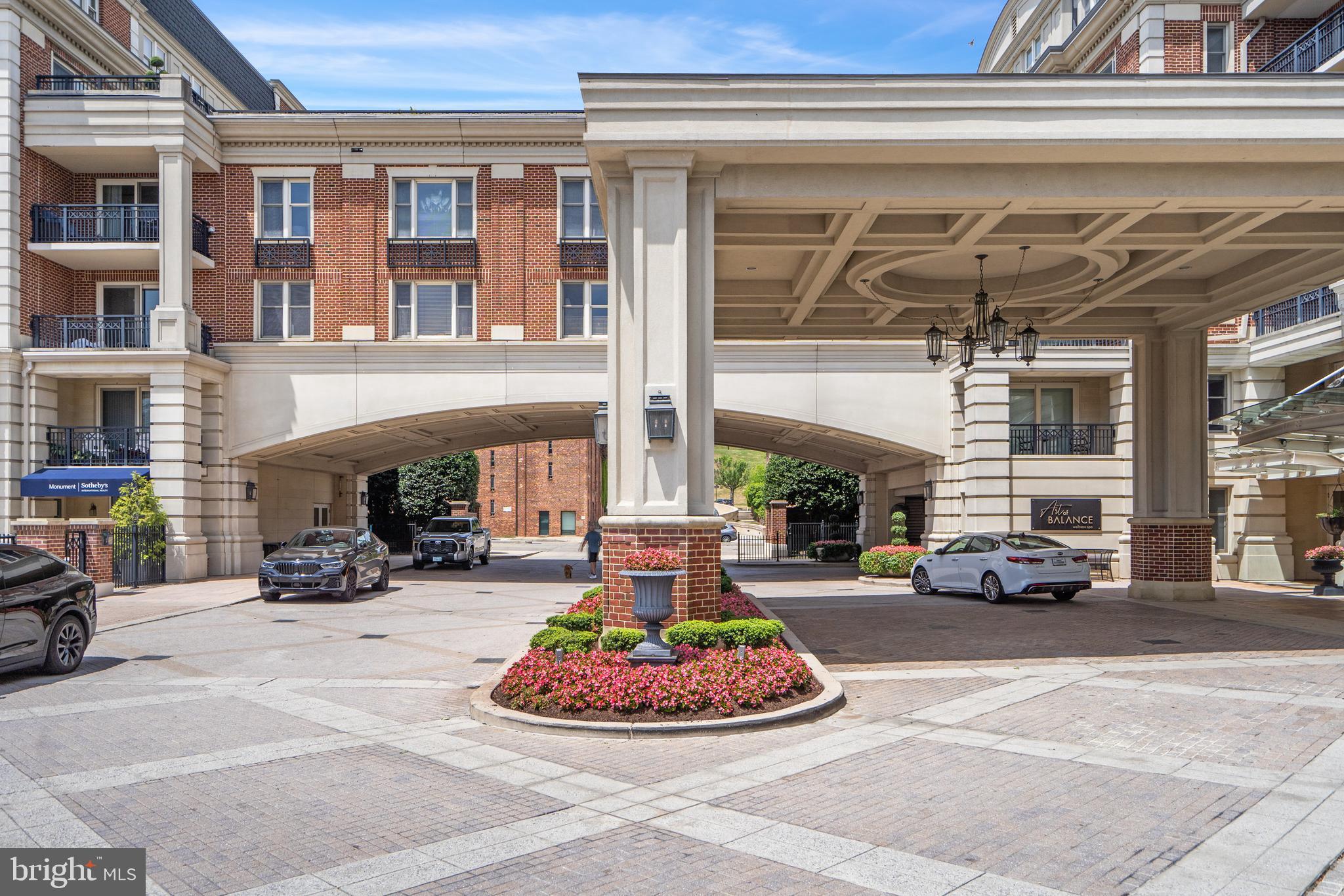 801 Key Highway, Unit 345 Baltimore, MD 21230 - Photo 45 of 57 a building with cars parked in front of it