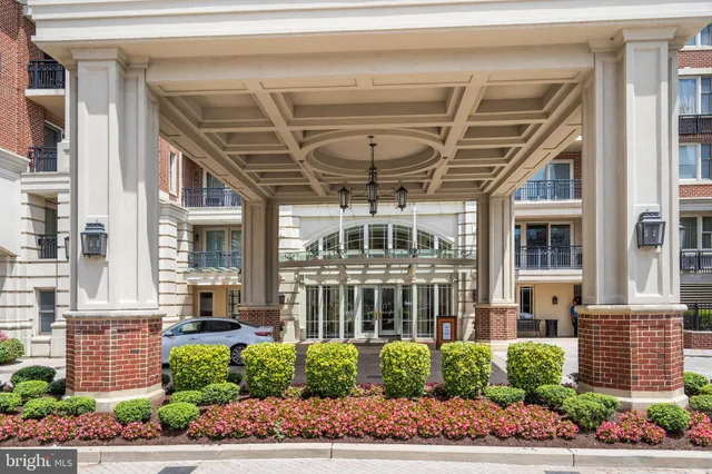 a living room with lots of furniture pool table and chairs