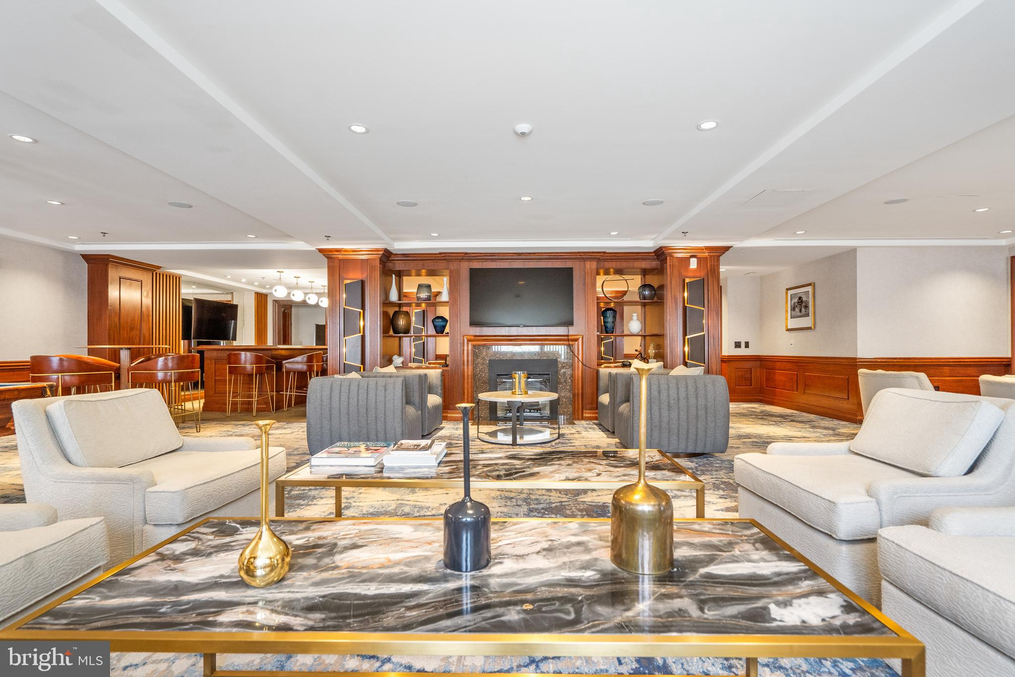 801 Key Highway, Unit 345 Baltimore, MD 21230 - Photo 50 of 57 a living room with couches coffee table and kitchen view with wooden floor