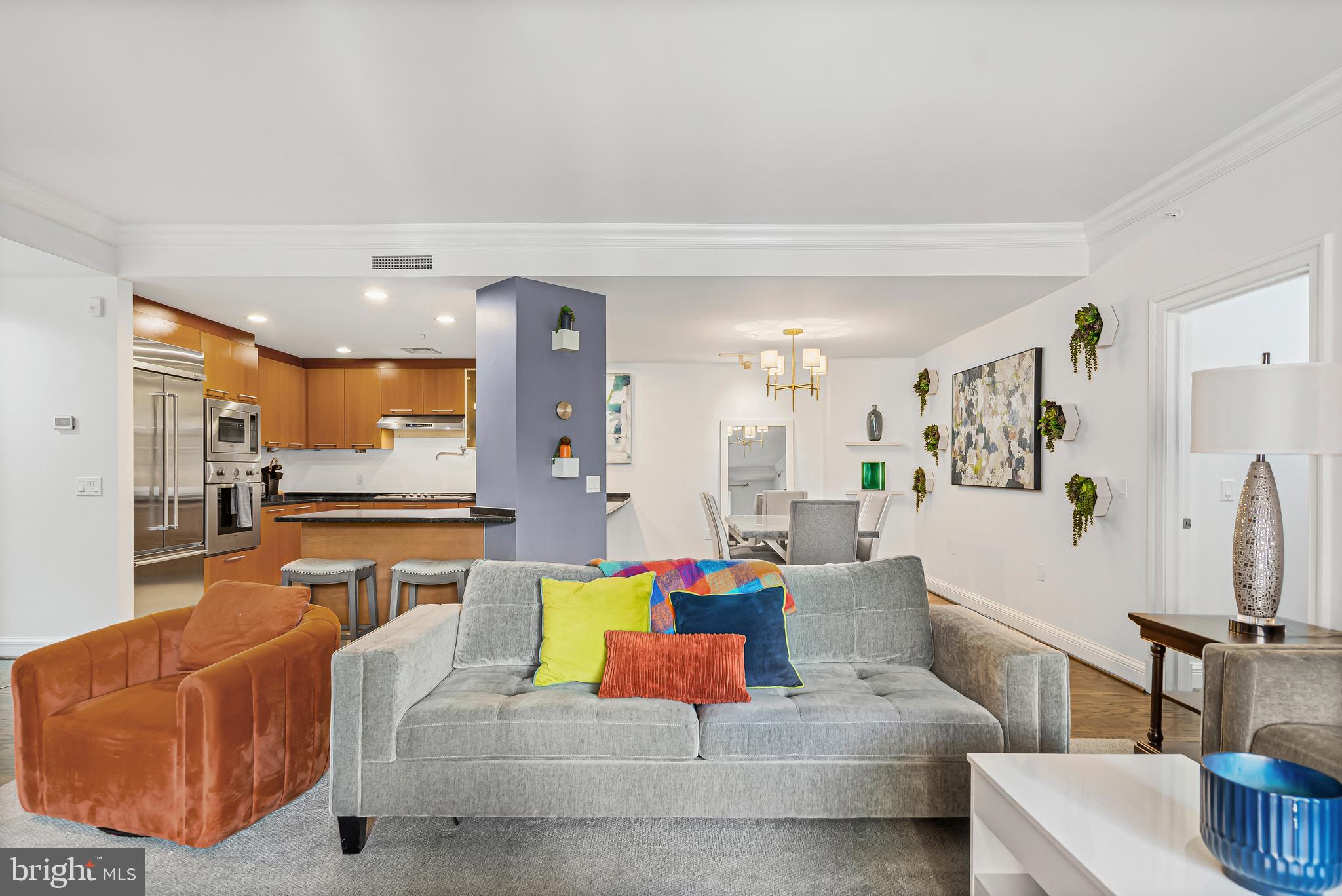 801 Key Highway, Unit 345 Baltimore, MD 21230 - Photo 5 of 57 a living room with furniture and a table