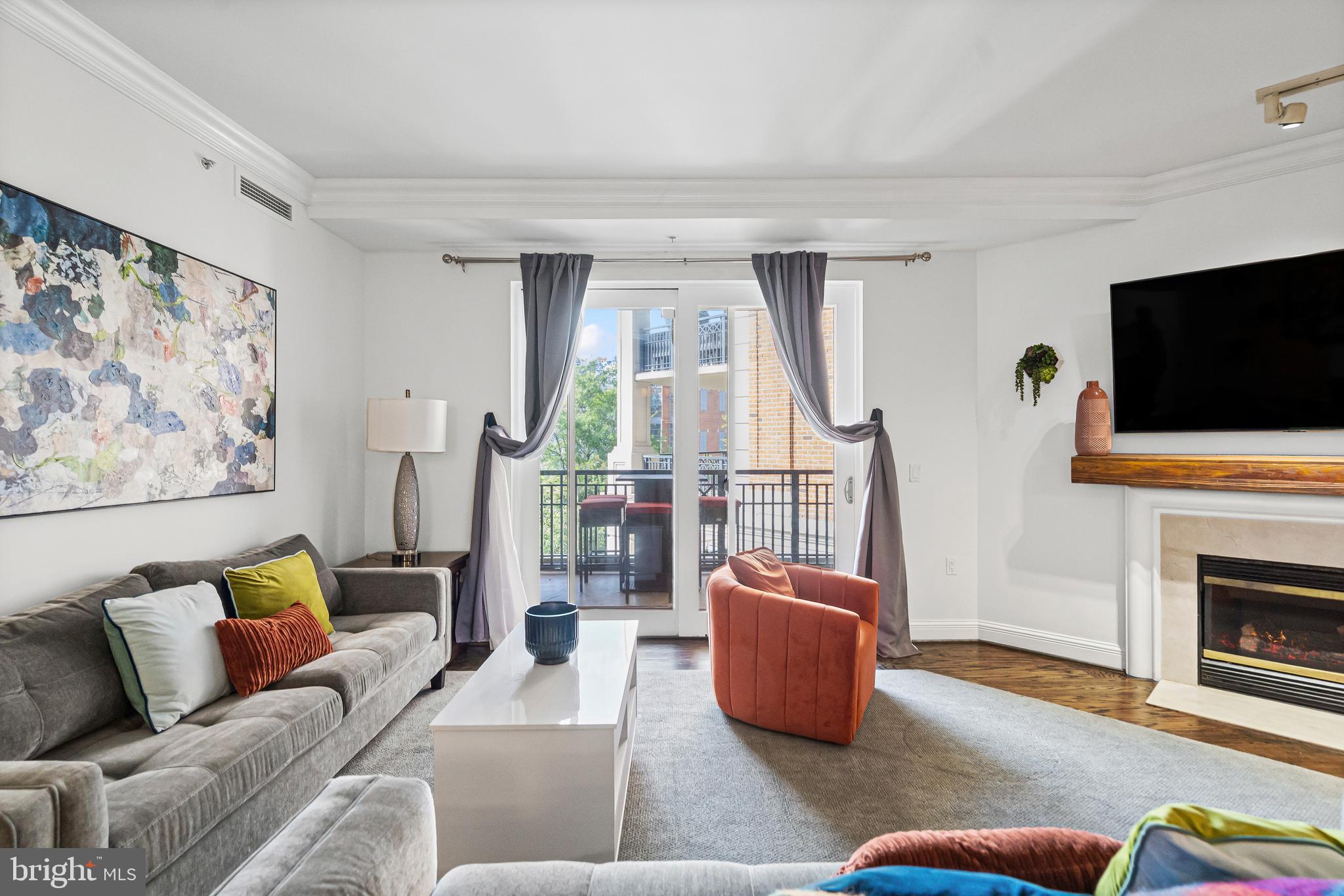 801 Key Highway, Unit 345 Baltimore, MD 21230 - Photo 8 of 57 a living room with furniture and a flat screen tv