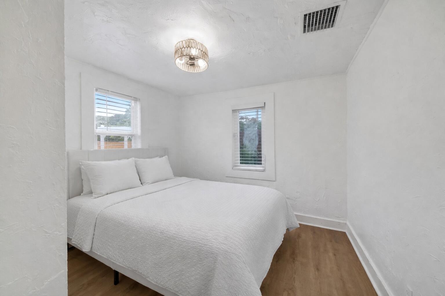 308 Southwest 1st Street Delray Beach, FL 33444 - Photo 11 of 26 a bedroom with a bed and a window