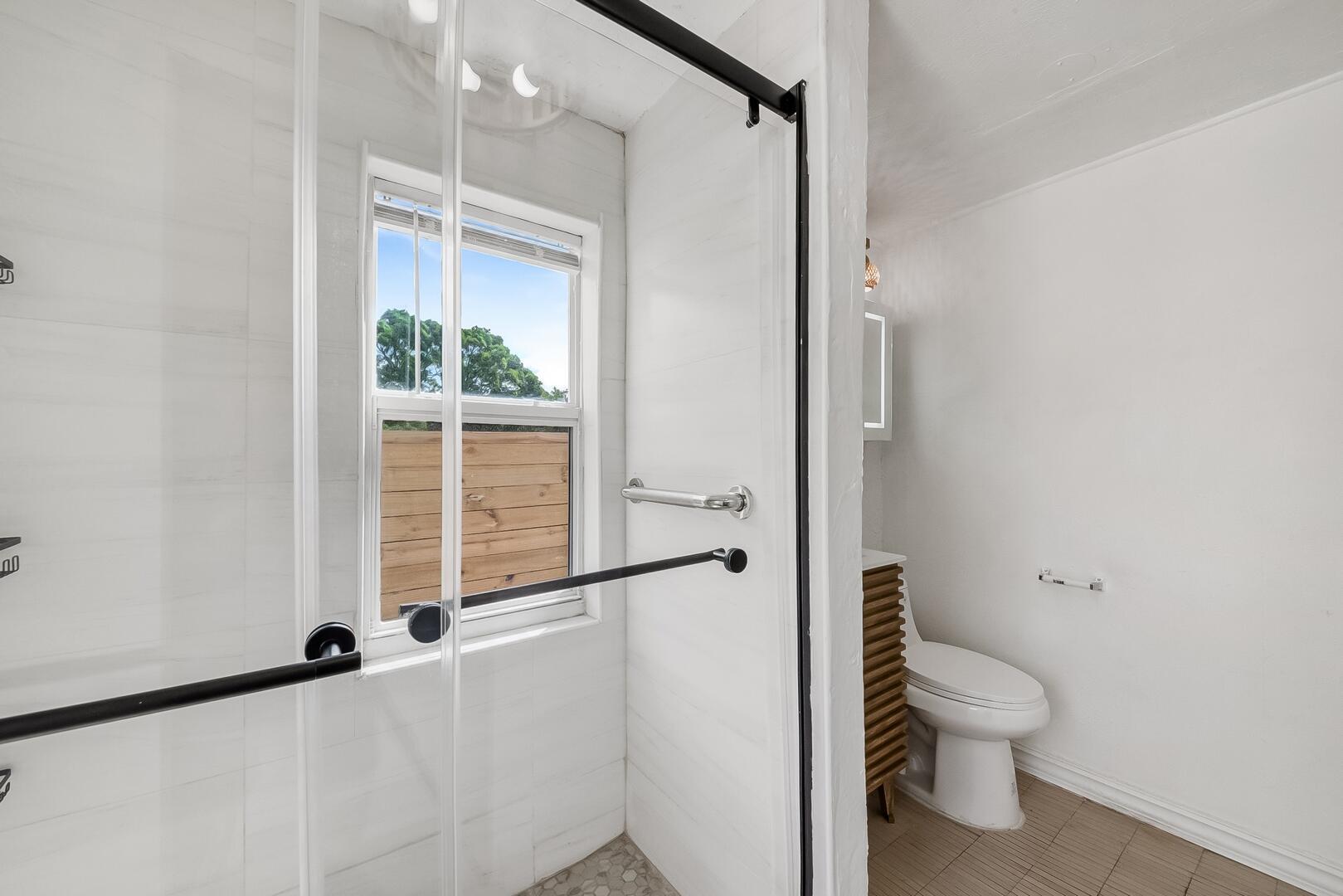308 Southwest 1st Street Delray Beach, FL 33444 - Photo 12 of 26 a bathroom with a toilet a sink and a window
