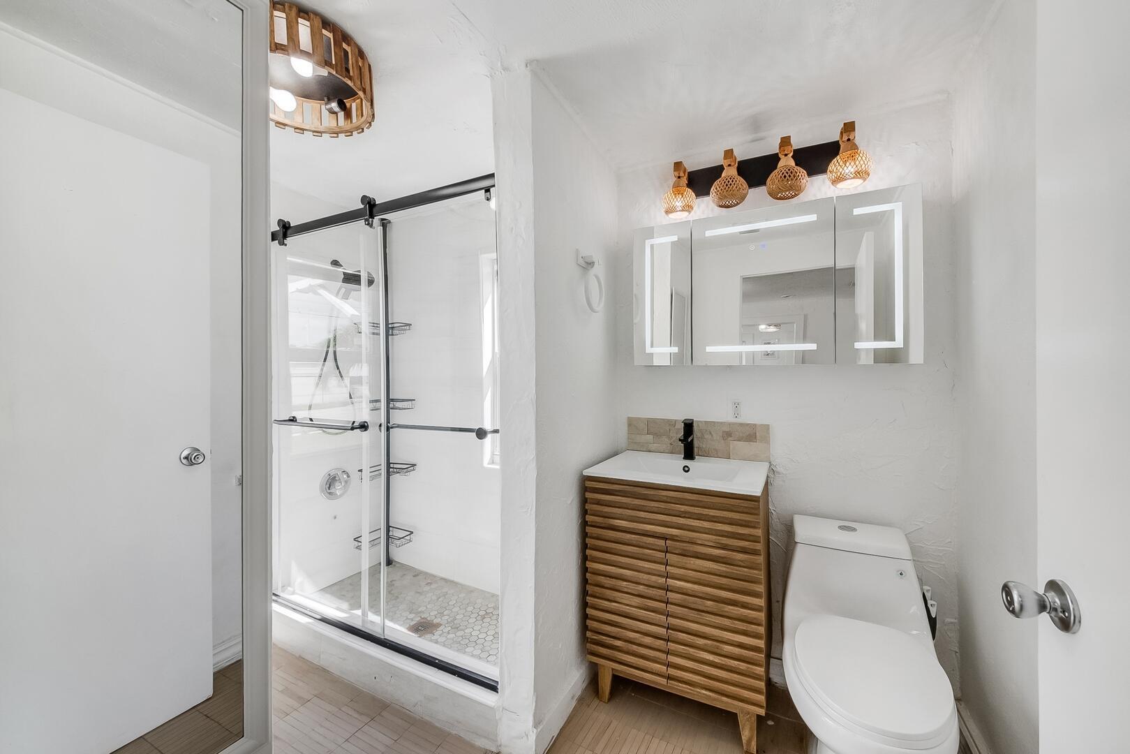 308 Southwest 1st Street Delray Beach, FL 33444 - Photo 13 of 26 a bathroom with a sink toilet and shower