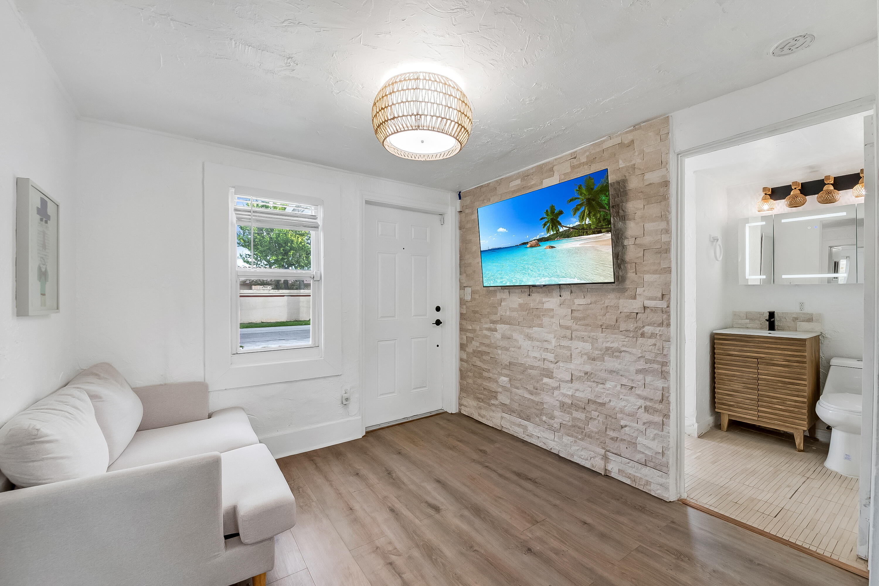 308 Southwest 1st Street Delray Beach, FL 33444 - Photo 2 of 26 a living room with furniture and a window