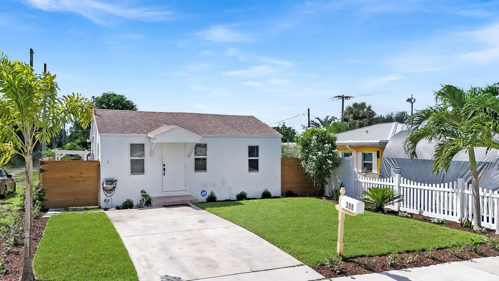 308 Southwest 1st Street Delray Beach, FL 33444 - Photo 26 of 26 a front view of a house with a yard