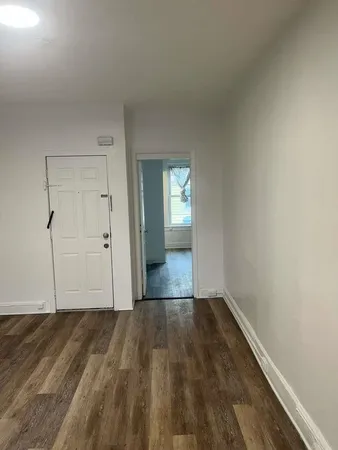 a view of wooden floor and staircase in a room