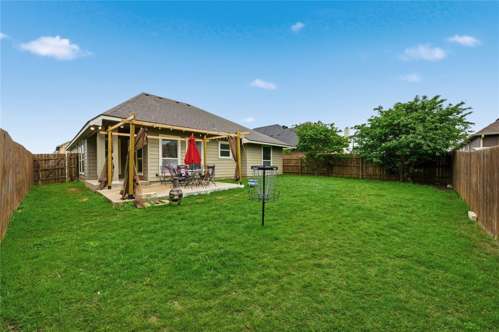 10808 Aurora Drive Waco, TX 76708 - Photo 21 of 23 a house view with a garden space