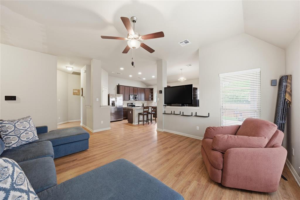10808 Aurora Drive Waco, TX 76708 - Photo 8 of 23 a living room with furniture and a flat screen tv