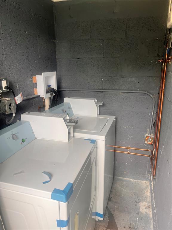 612 Northwest 6th Court, Unit 1 Hallandale Beach, FL 33009 - Photo 3 of 3 a bathroom with a sink a toilet and mirror