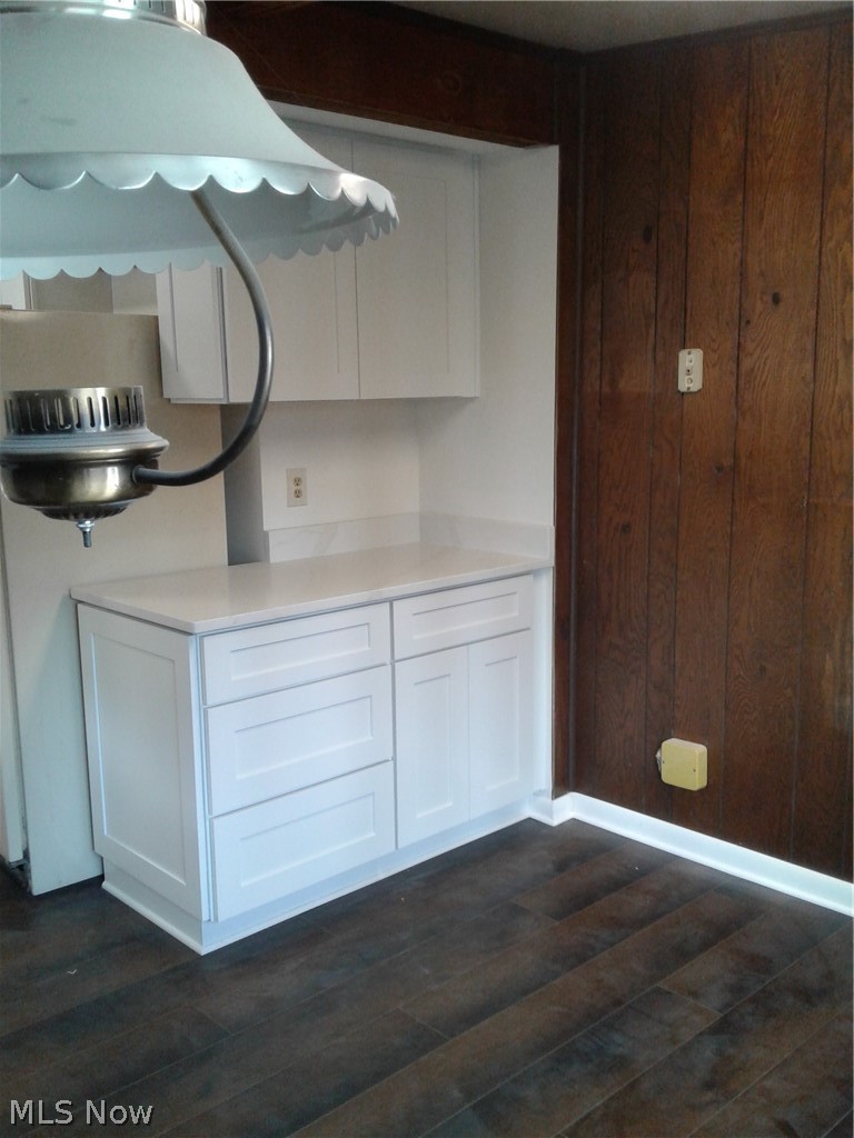 613 Jackson Street Amherst, OH 44001 - Photo 7 of 29 white cabinets and dining area