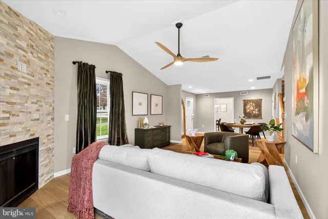 a living room with furniture fireplace and a flat screen tv