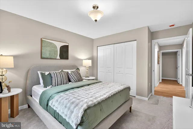 an empty room with windows and closet