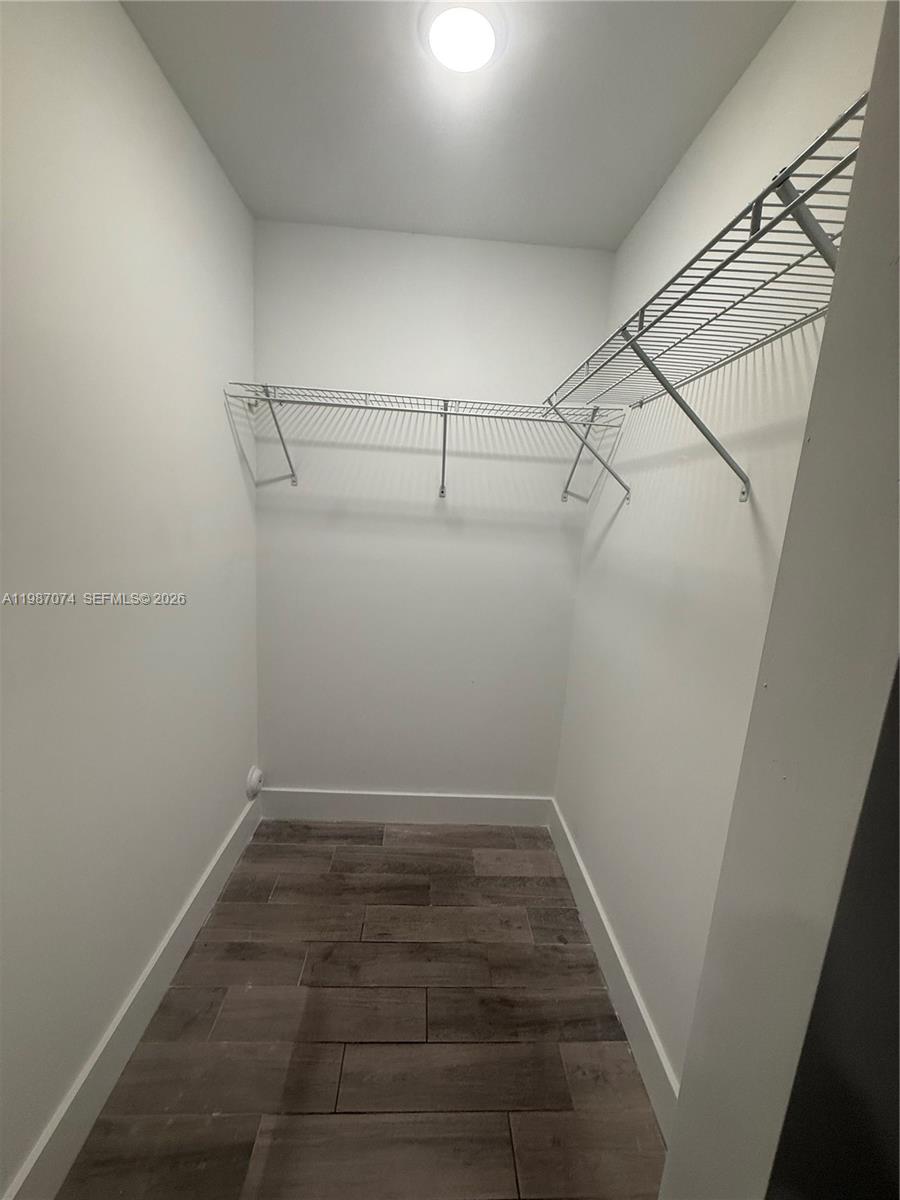 486 East 30th Street, Unit 202 Hialeah, FL 33013 - Photo 12 of 16 a view of a room with racks on the wall