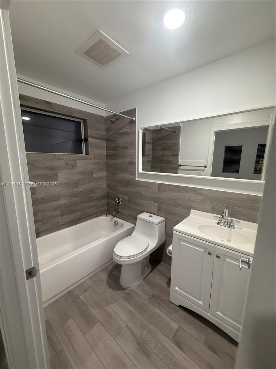486 East 30th Street, Unit 202 Hialeah, FL 33013 - Photo 13 of 16 a bathroom with a sink a toilet and bathtub