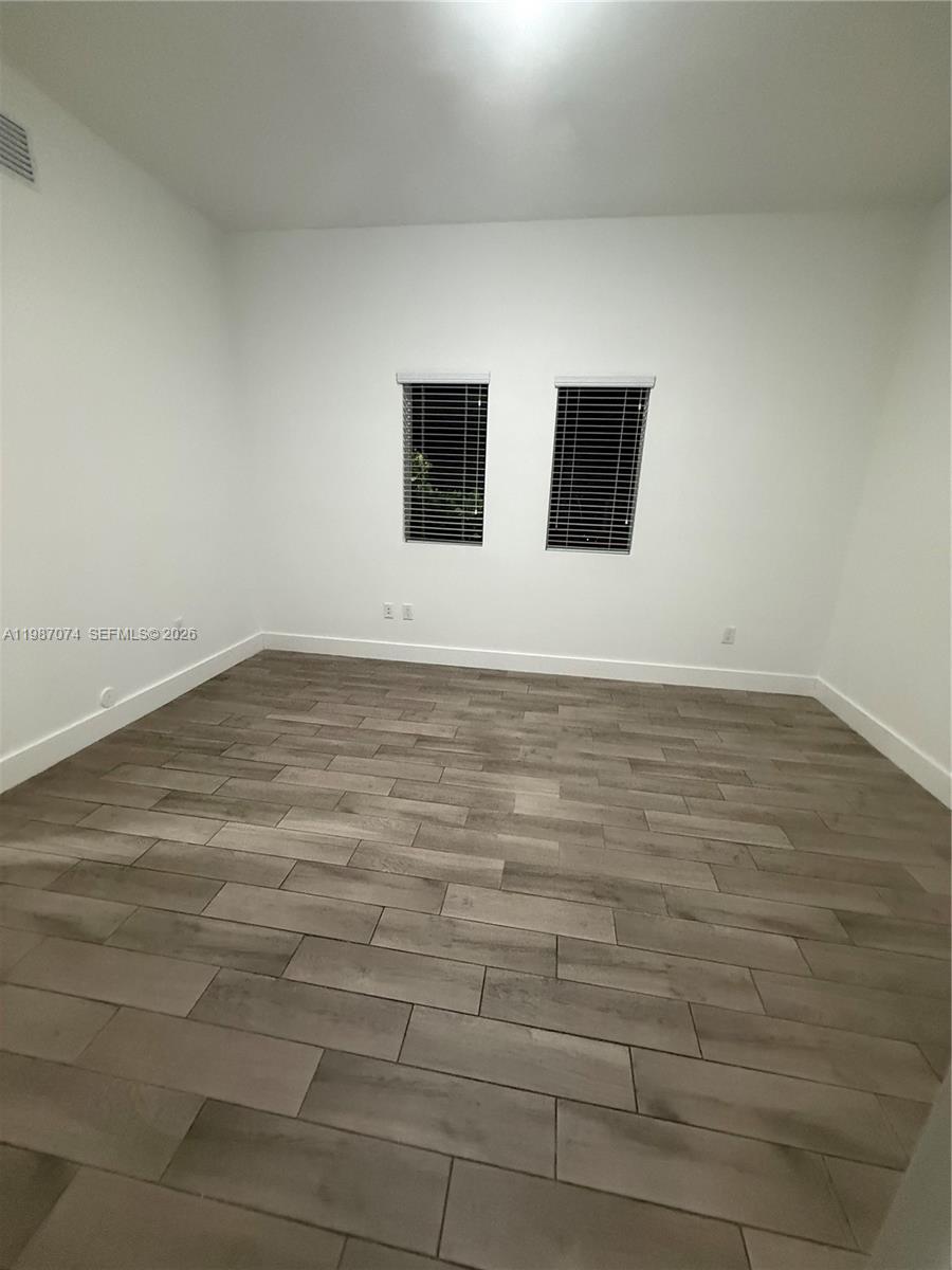 486 East 30th Street, Unit 202 Hialeah, FL 33013 - Photo 14 of 16 a view of an empty room