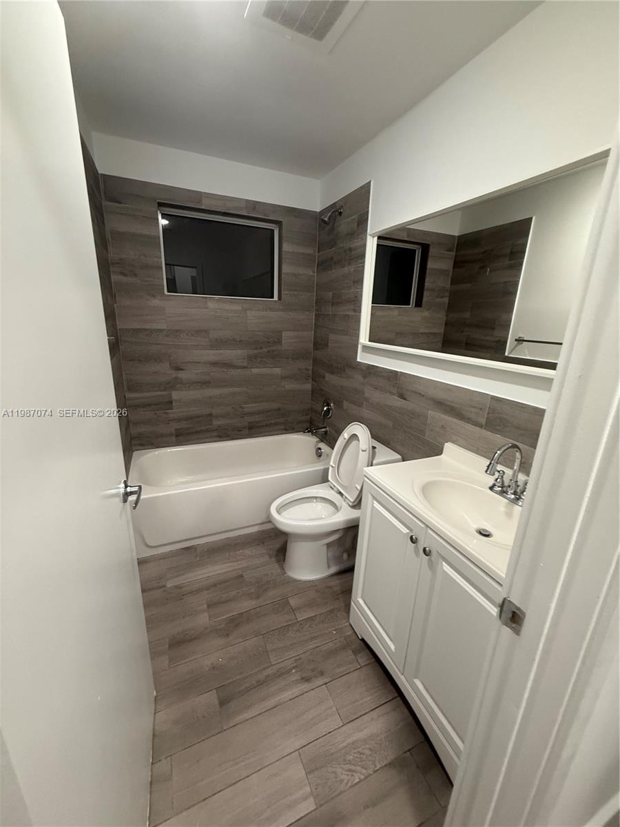 486 East 30th Street, Unit 202 Hialeah, FL 33013 - Photo 7 of 16 a bathroom with a sink a toilet and bathtub