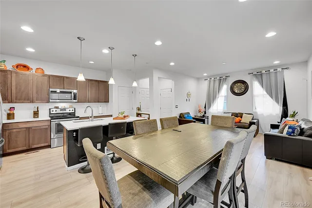 a kitchen with a table and chairs in it