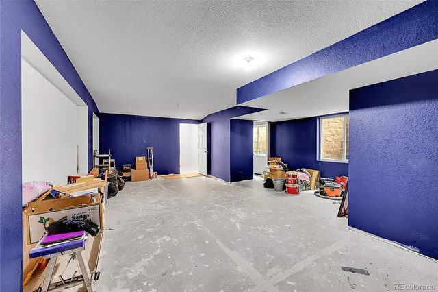 a car parked in a room next to a window