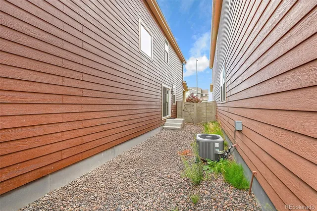 a view of a backyard with sitting area