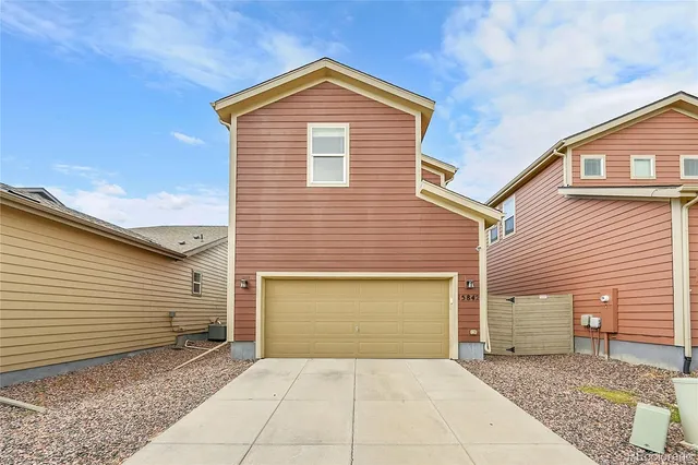a front view of a house with yard