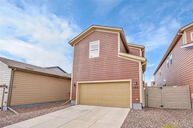 a front view of a house with a garage