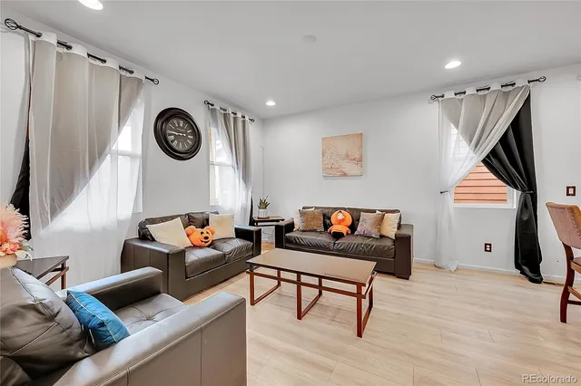 a living room with furniture and a window