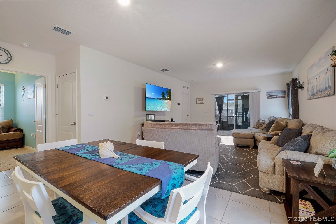 354 Camilla Road DeLand, FL 32724 - Photo 11 of 57 a living room with furniture a rug and a table