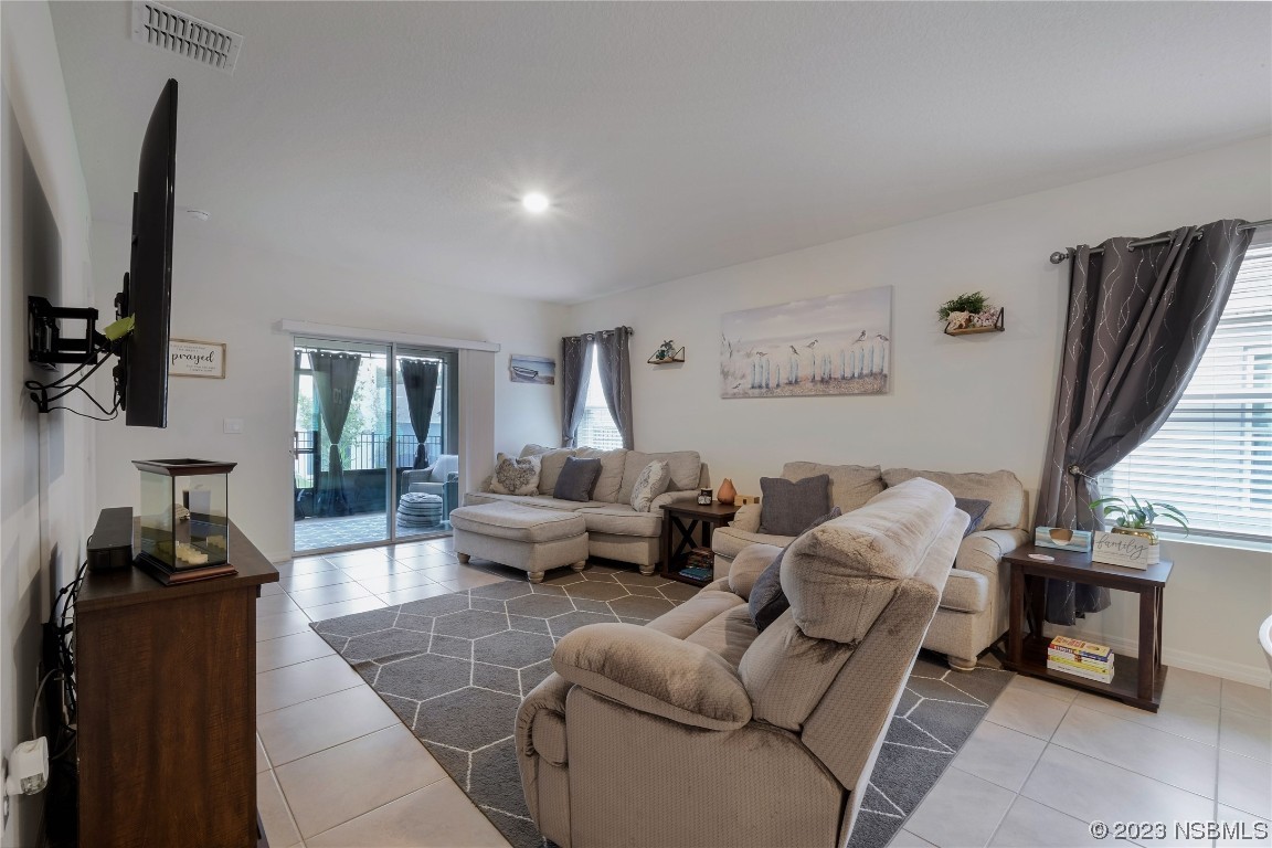 354 Camilla Road DeLand, FL 32724 - Photo 13 of 57 a living room with furniture wooden floor and a flat screen tv