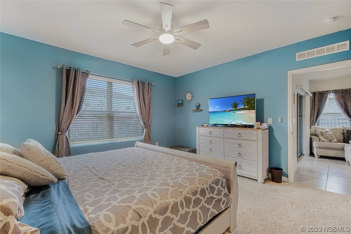 354 Camilla Road DeLand, FL 32724 - Photo 20 of 57 a bedroom with a bed and a couch