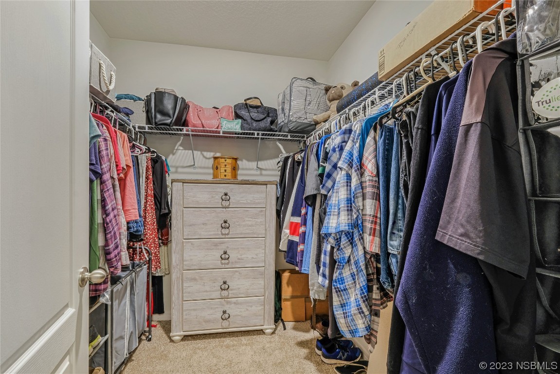 354 Camilla Road DeLand, FL 32724 - Photo 25 of 57 a view of walk in closet with clothes and shoes