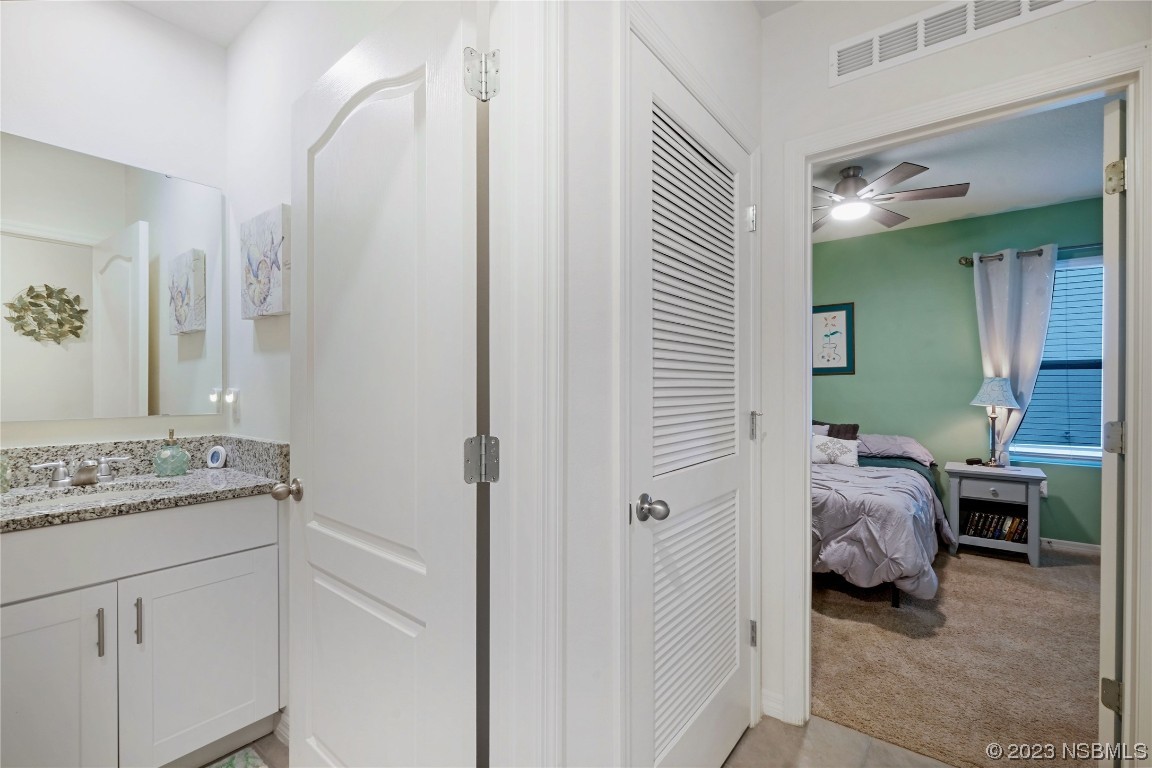 354 Camilla Road DeLand, FL 32724 - Photo 26 of 57 a en suite bathroom with a sink and a mirror