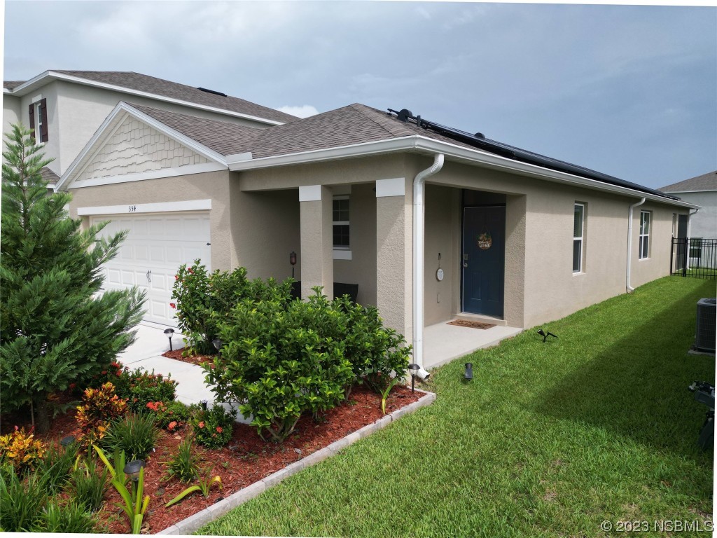354 Camilla Road DeLand, FL 32724 - Photo 37 of 57 a front view of a house with a yard and porch