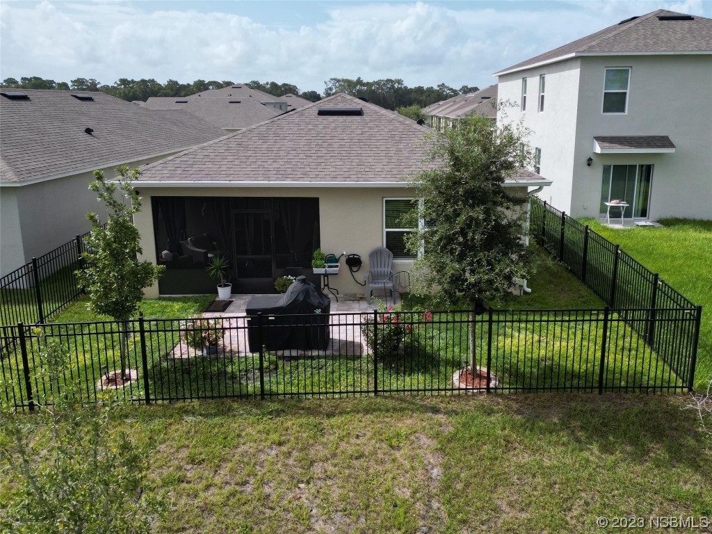 354 Camilla Road DeLand, FL 32724 - Photo 39 of 57 a view of house in front of a big yard and potted plants