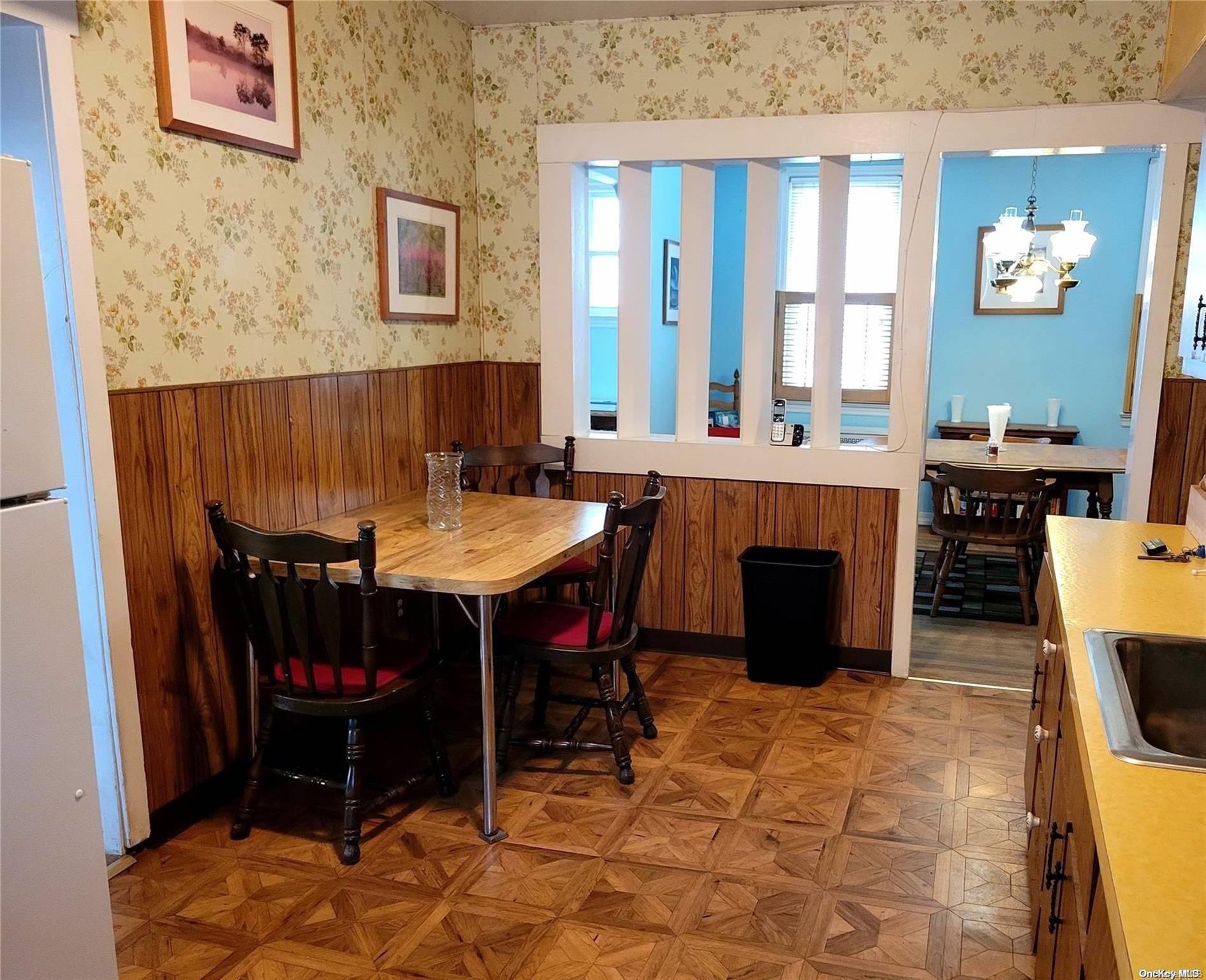 138 Hewlett Avenue Merrick, NY 11566 - Photo 11 of 35 a view of a dining room with furniture
