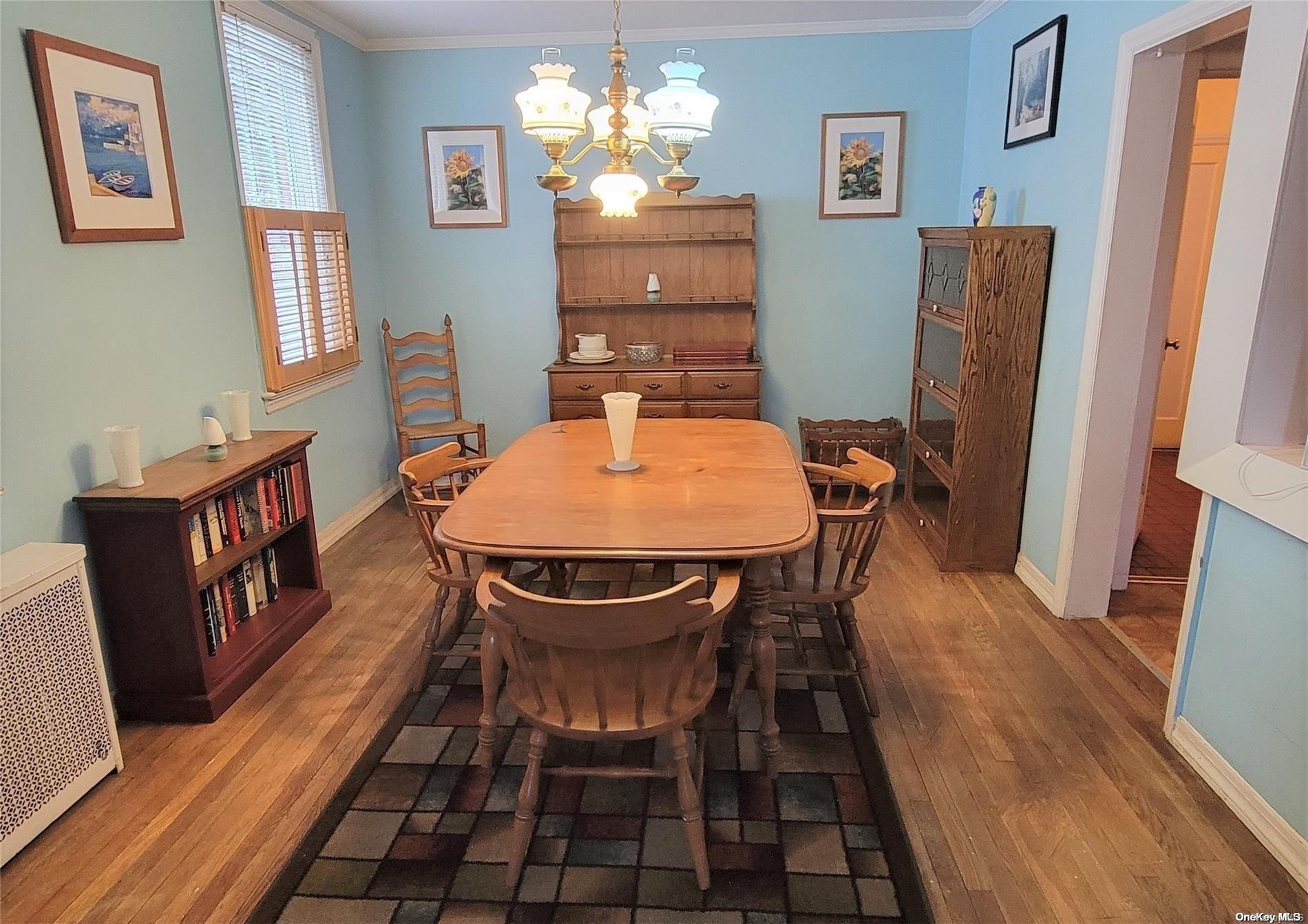 138 Hewlett Avenue Merrick, NY 11566 - Photo 14 of 35 a view of a dining room with furniture window and wooden floor