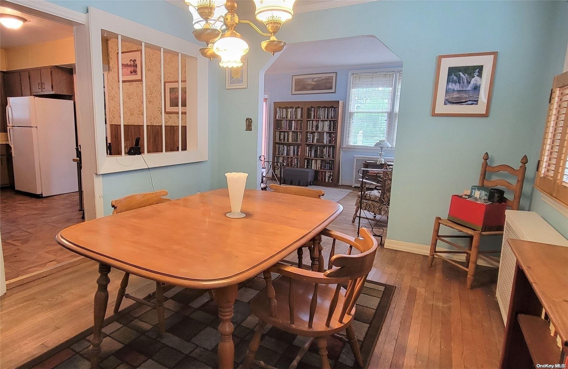 138 Hewlett Avenue Merrick, NY 11566 - Photo 15 of 35 a dining room with furniture and window