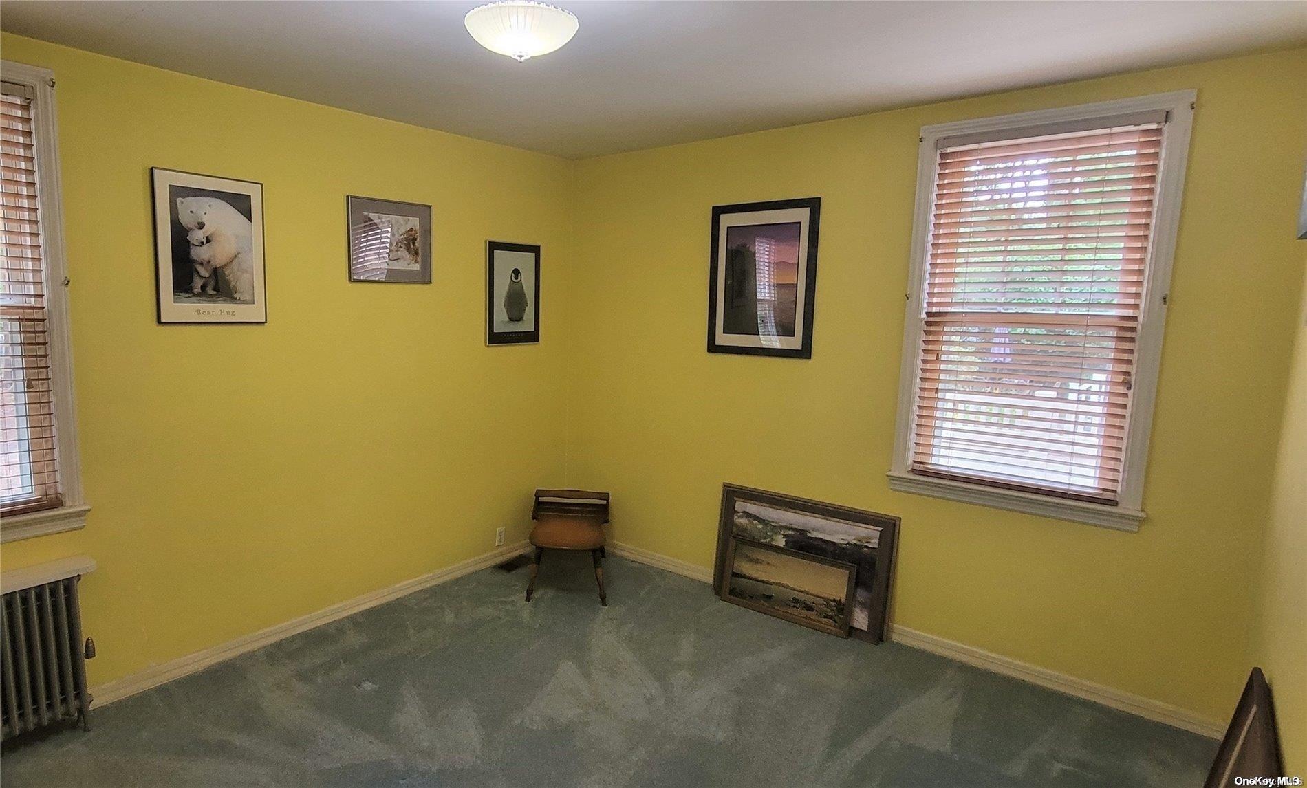 138 Hewlett Avenue Merrick, NY 11566 - Photo 22 of 35 a room with pool table and two windows