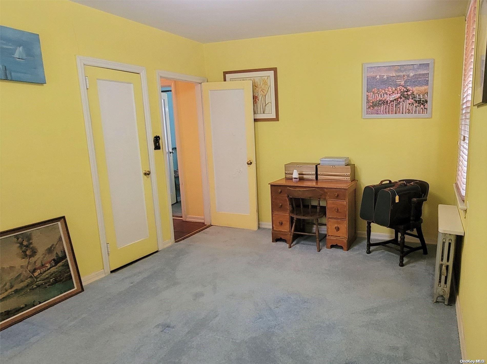 138 Hewlett Avenue Merrick, NY 11566 - Photo 23 of 35 a view of a workspace with furniture and a window