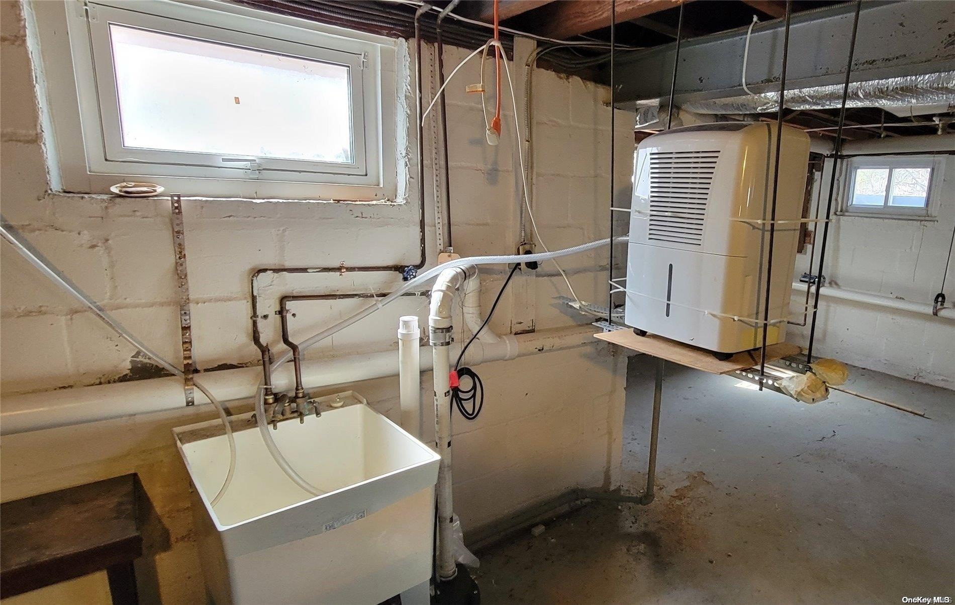 138 Hewlett Avenue Merrick, NY 11566 - Photo 30 of 35 a utility room with dryer and washer
